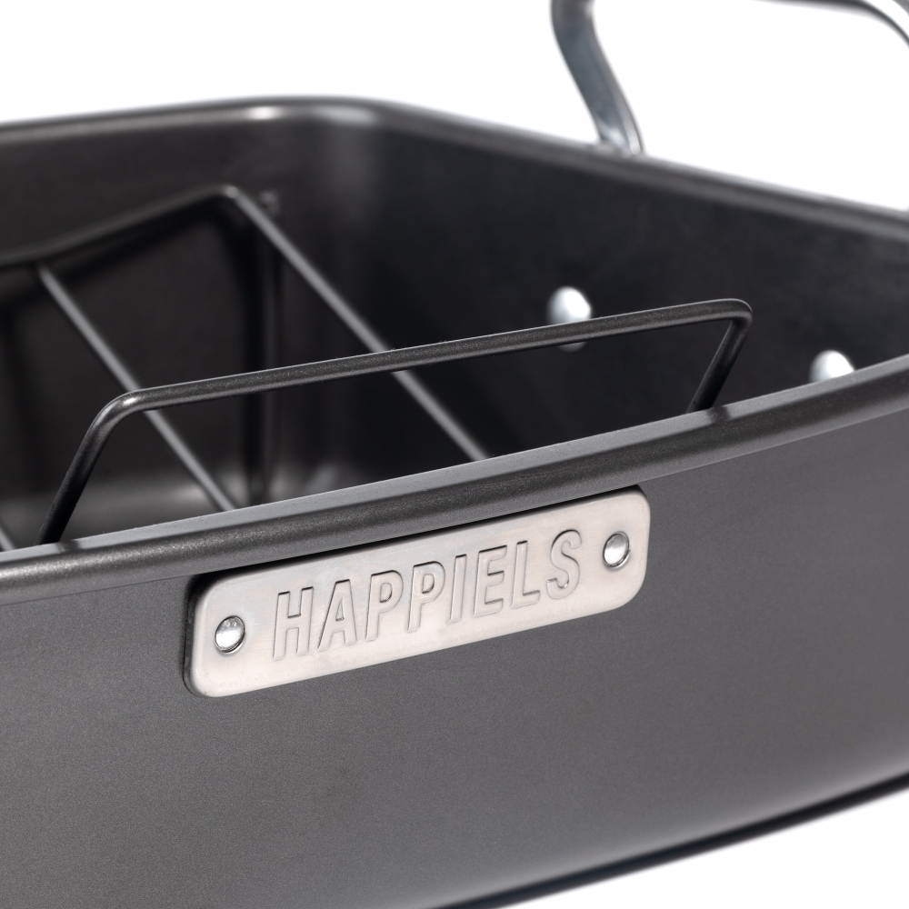 Black metal grill basket with 'Happiels' branding on a white background